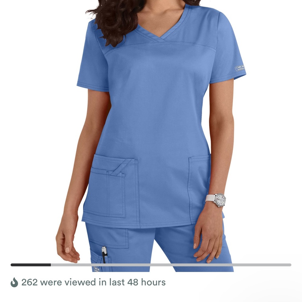 Woman’s black scrub top
